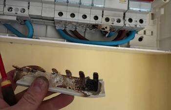 Damaged dual RCD consumer unit with overheating caused by loose shower circuit in Darlington